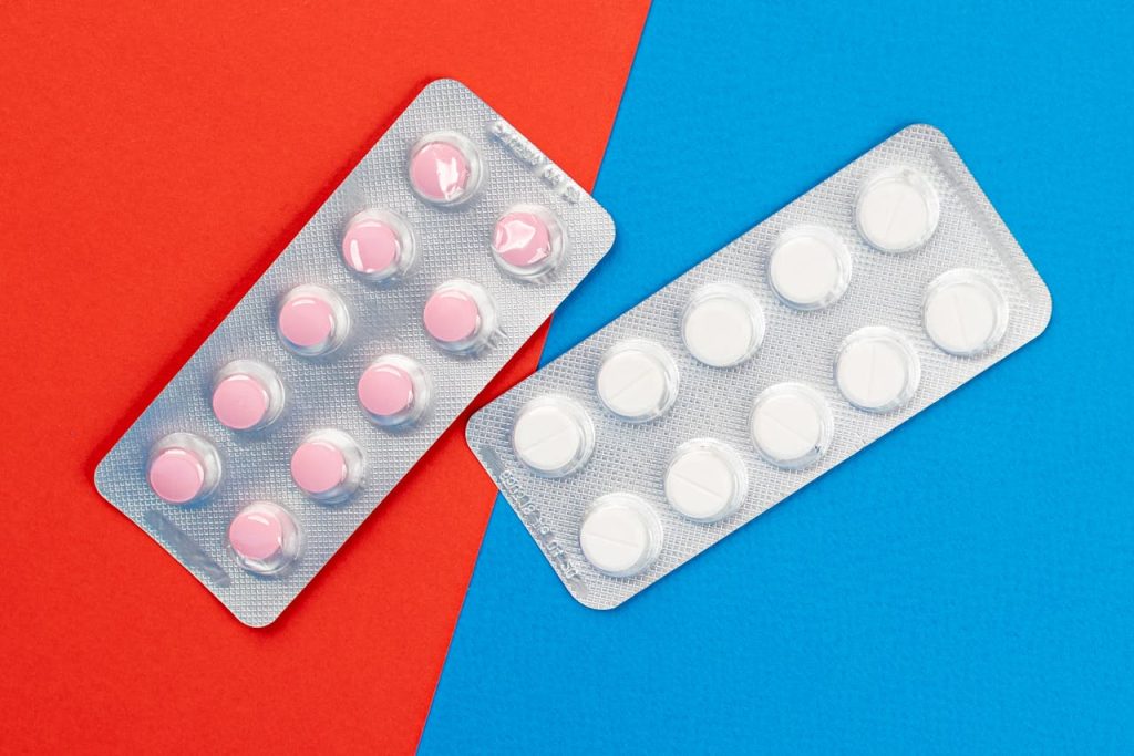 Pink and White Tablets on the Table